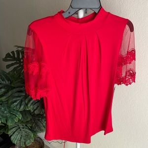 Red Blousse! Size Medium ! With mesh design sleeves